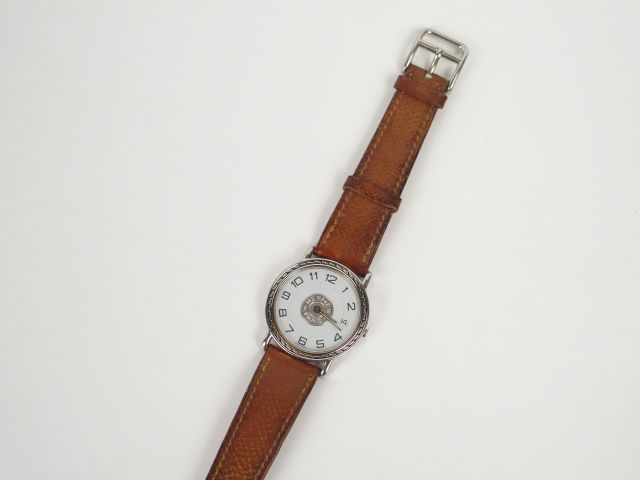 HERMES. Montre homme, modèle Sellier, boitier acier, bracelet cuir mar