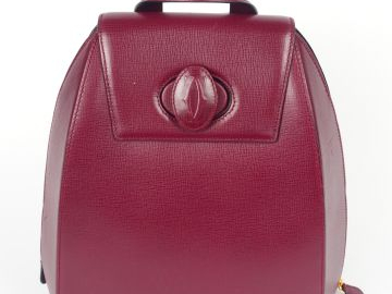 CARTIER. Sac à dos en cuir lisse bordeaux. Etat neuf