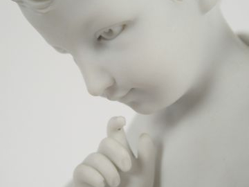 Sculpture en biscuit d'après FALCONET "Amour". H. : 23 cm