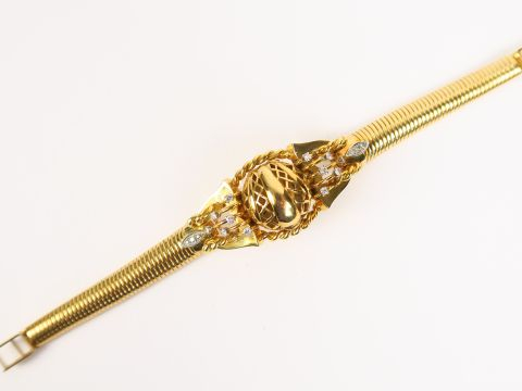 MERCURY. Montre de dame en or, bracelet turbogaz, cadran dôme ajouré o