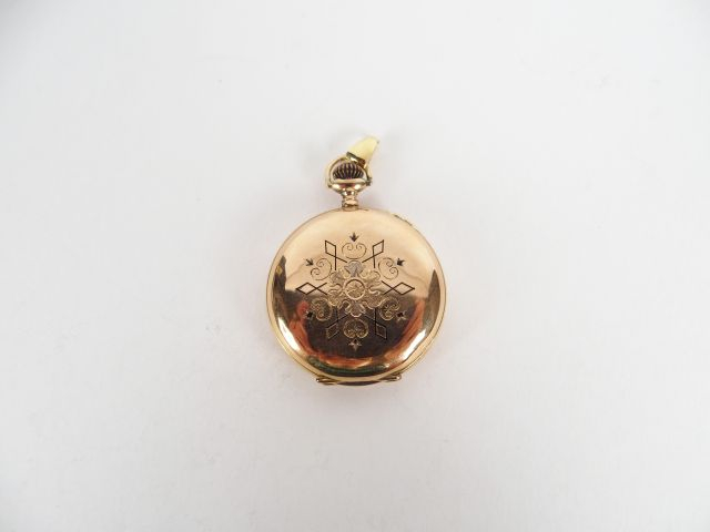 Montre savonnette en or jaune, décor d'émail "Profil de femme", 10 rub