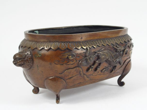 Jardinière en bronze à patine mordorée, orné d'un dragon et d'un Phoen