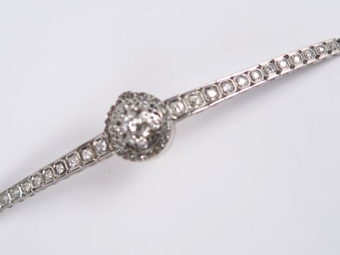 GERALDY. Montre bracelet à  en or blanc et platine, bracelet et couver