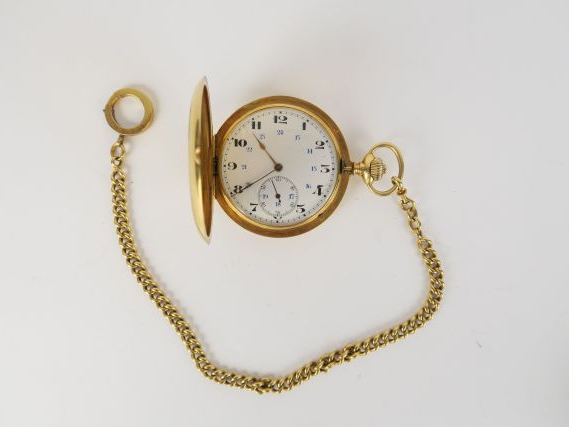 Montre savonnette en or et sa giletière (poids de la giletière 30 g). 