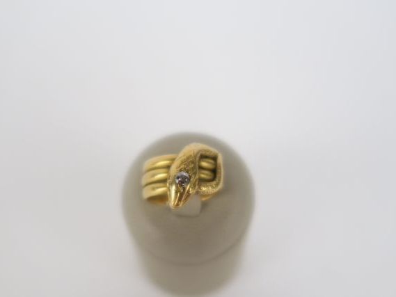 Bague serpent en or ornée d'un brillant, taille ancienne. 11 g tel