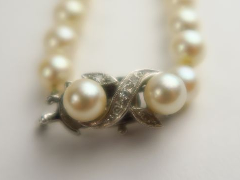 Sautoir de perles de culture, fermoir en or blanc 14 carats, rehaussé 