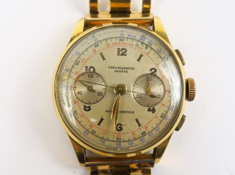 Montre Chronographe, Genève. Cadran en or, bracelet en métal doré. Poi