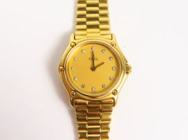 EBEL. Montre de dame, boitier et bracelet or, cadran orné de 12 brilla