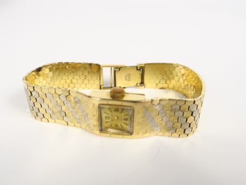 EXACTUS. Montre de dame, boitier et bracelet en or. Poids tel : 36,6 g