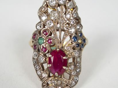 Bague de style Art déco en or jaune, décor de gerbe fleurie et de nœud