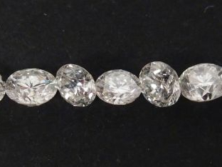 7 diamants taille moderne sur papier:- 0,14ct environ, - 2 x 0,16ct en