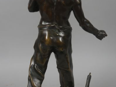 ROUSSEAU « Le mineur » Sculpture en bronze à patine brune.  Signée.  H