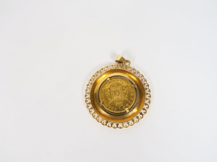 Pendentif en or orné d'une pièce de 20 Francs 1869. Poids. 12,41 gr