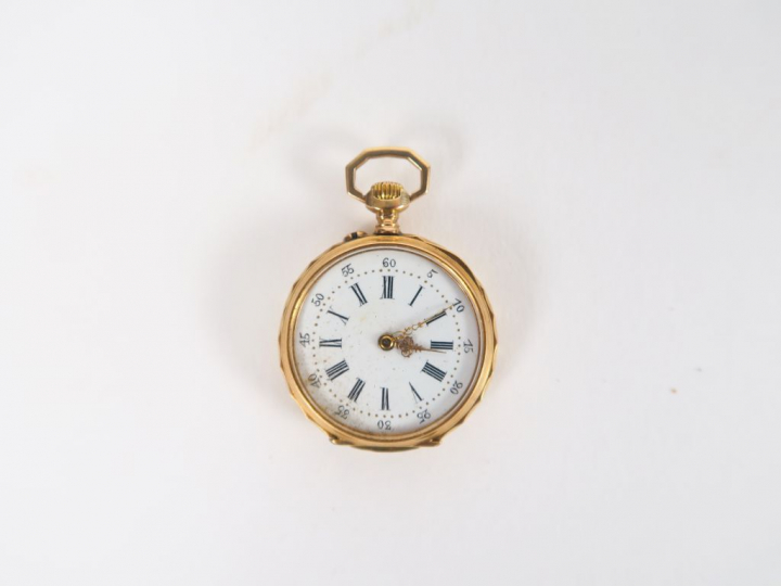 Montre de col en or.  Poids tel. 19,7 gr