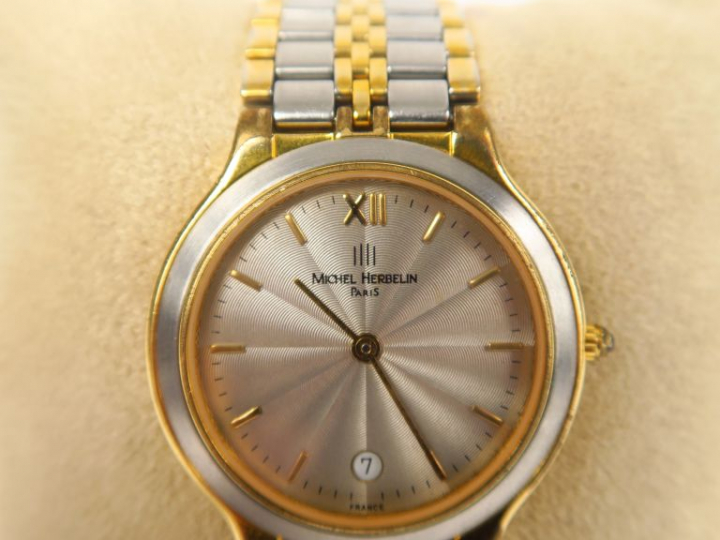 Michel HERBELIN  Montre de dame en métal et métal doré.