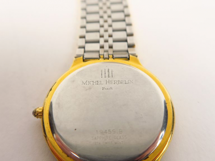 Michel HERBELIN  Montre de dame en métal et métal doré.