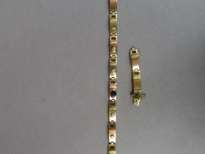 Bracelet articulé en or 14k, orné d'une pierre bleue et de quatre peti