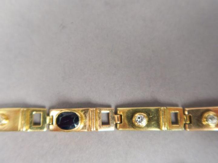 Bracelet articulé en or 14k, orné d'une pierre bleue et de quatre peti