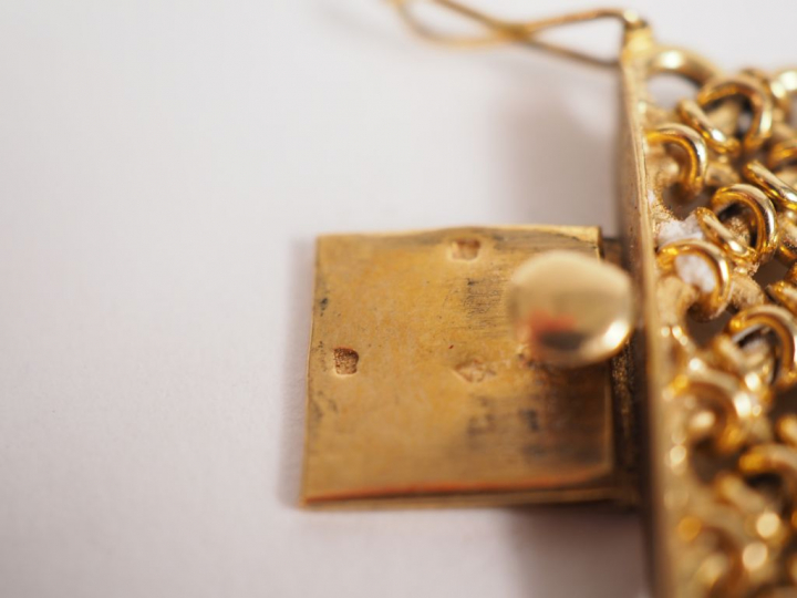 Parure en or jaune, comprenant un collier draperie et un bracelet manc