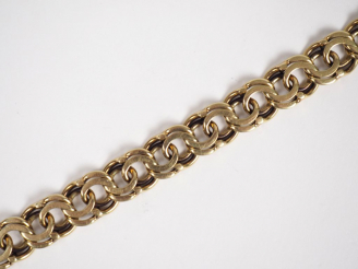 Vente aux enchères Bracelet souple en or jaune 14k, maille faite de cercles entrelacés. L