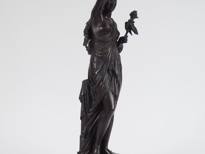 Jean BULIO. 'Jeune femme à la marionette'. Sculpture en bronze à patin