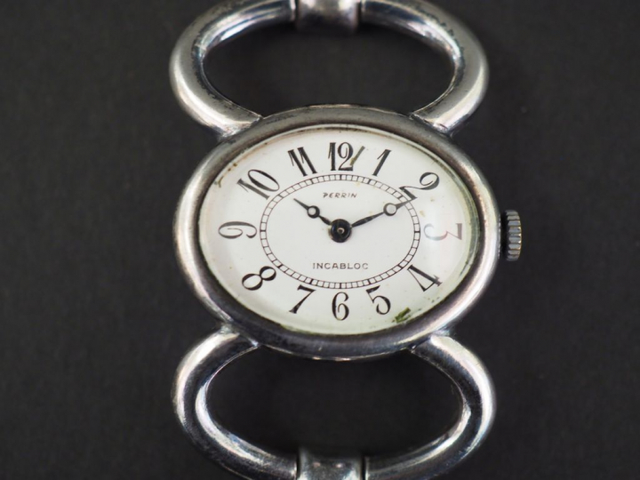 PERRIN. Montre bracelet de dame en argent 800 millièmes.  Long. 16,5 c