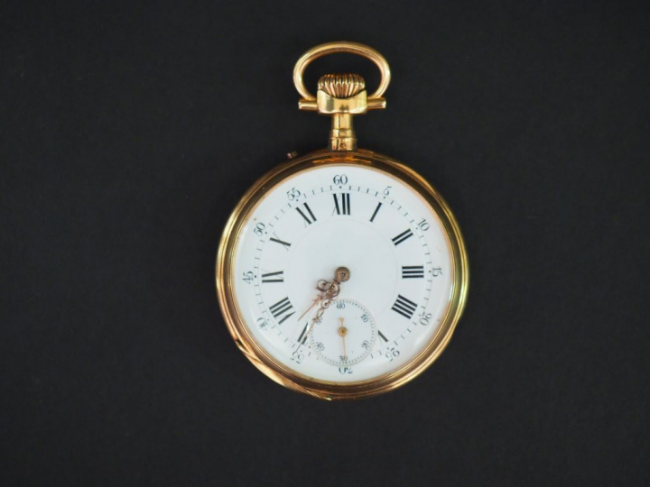 Montre de gousset en or jaune.  Cadran à chiffres romains pour les heu