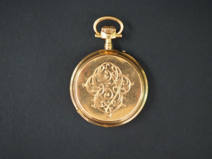 Montre de gousset en or jaune.  Cadran à chiffres romains pour les heu