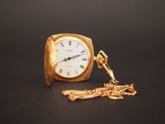 Vente aux enchères Montre aveugle et sa giletière en métal doré.