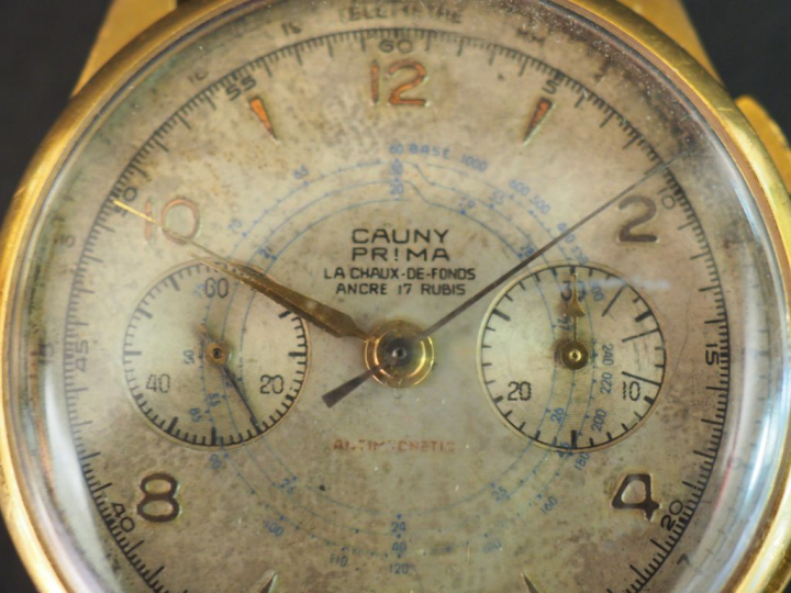 CAUNY. Montre d'homme, boitier or.