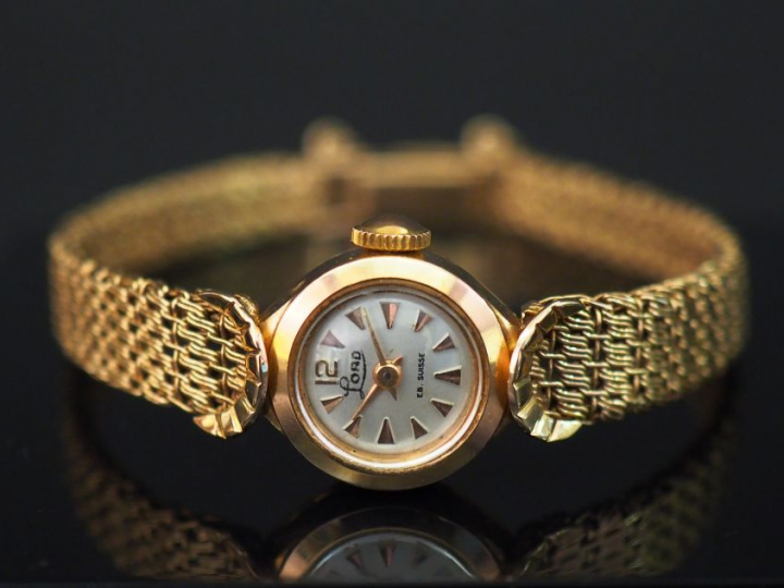 	LORD Montre bracelet de dame  de style 1930 en or jaune. Cadran rond.