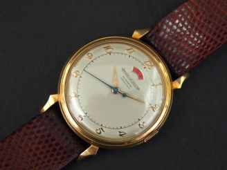 Vente aux enchères JAEGER LECOULTRE.  Réserve de Marche. Montre d’homme.  Boitier en or j