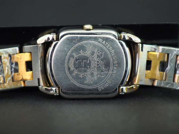 HERMES Montre bracelet de dame, modèle Rallye, en acier et métal doré.