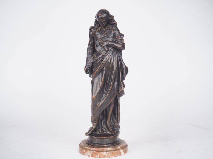 Désiré MARIE. "Corneille". Sujet en régule sur un socle en marbre roug