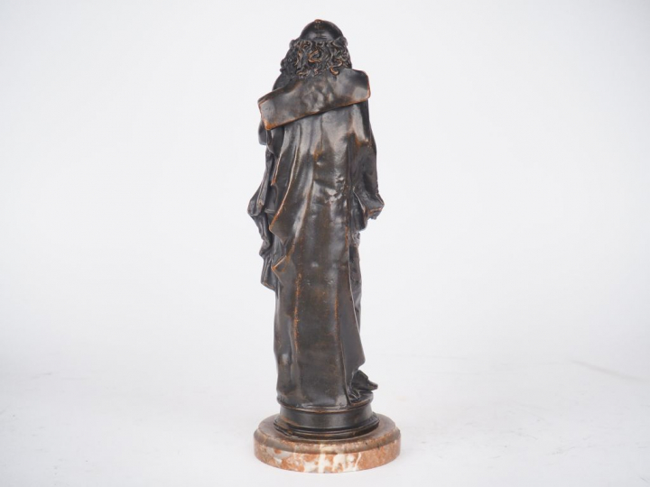 Désiré MARIE. "Corneille". Sujet en régule sur un socle en marbre roug