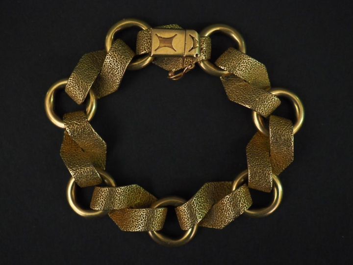 Bracelet articulé en or jaune, composé de maillons ronds et maillons l