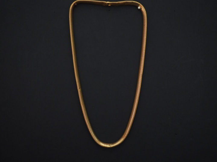 	Collier en or jaune, maille articulée dite « tubogaz ». Long. 44,5 cm