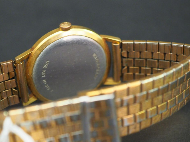 TISSOT, Seastar Seven Montre bracelet d’homme en plaqué or.  Cadran ro