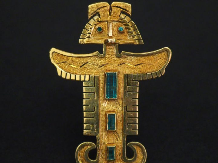 Broche/pendentif en or jaune et pierres de couleur en forme de divinit