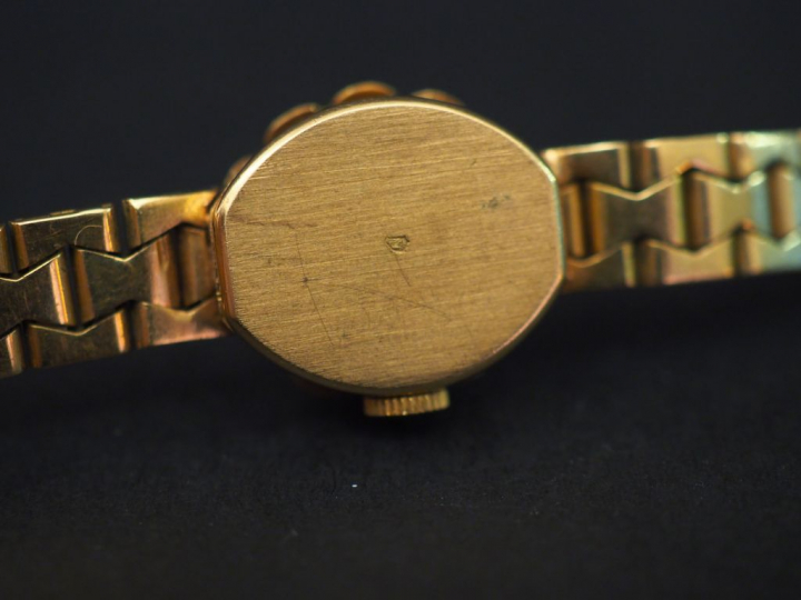 GERMOR Montre bracelet de dame, boitier et bracelet en or jaune. Cadra