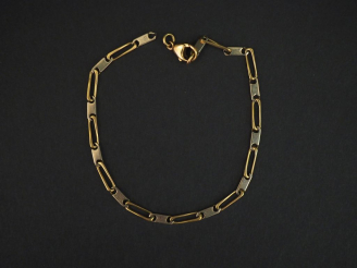 Vente aux enchères Bracelet articulé deux tons d’or. Long. 19 cm Poids. 6,69 g  (fermoir 