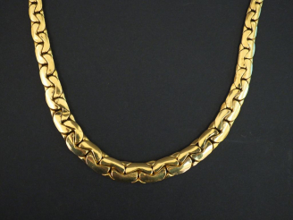 Vente aux enchères Collier articulé en or jaune, maille haricot disposée en chute. Long. 