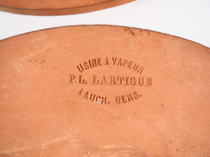 P. L. LARTIGUE.  Suite de quatre médaillons en terre cuite figurant de