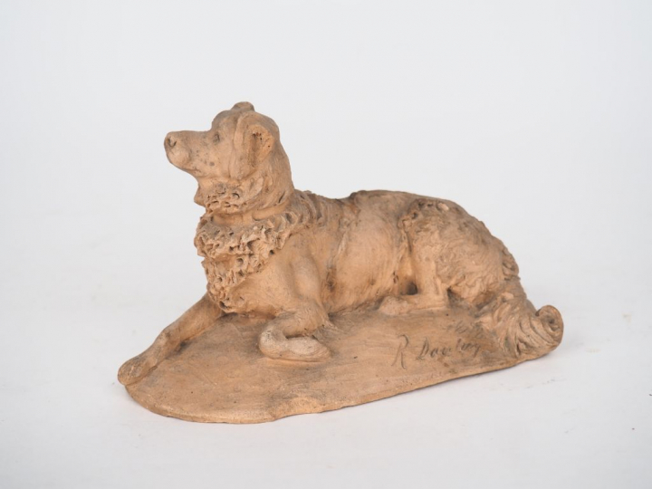 Sujet XIXème en terre cuite originale "chien berger couché".  Signé et
