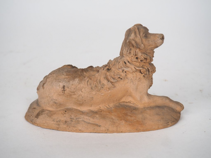 Sujet XIXème en terre cuite originale "chien berger couché".  Signé et