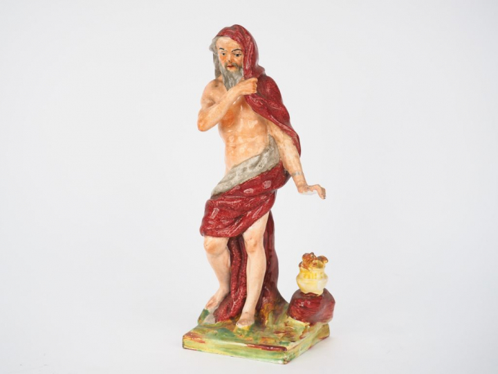 Sujet XVIIIème en faïence polychrome "allégorie de l'hiver". Dim. 22  