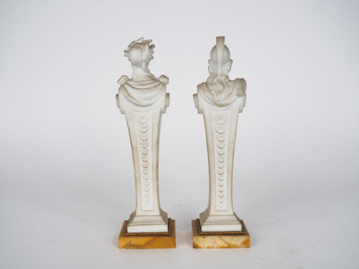 Paire de sujets en biscuit figurant des personnages antiques en gaine,