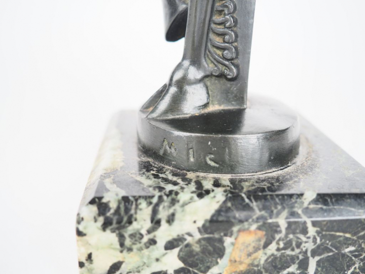 Sujet en régule à patine noire, socle en marbre "Faune musicien". Sign