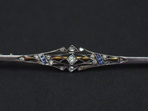 Broche barrette ajourée en or jaune et argent, sertie de pierres bleue