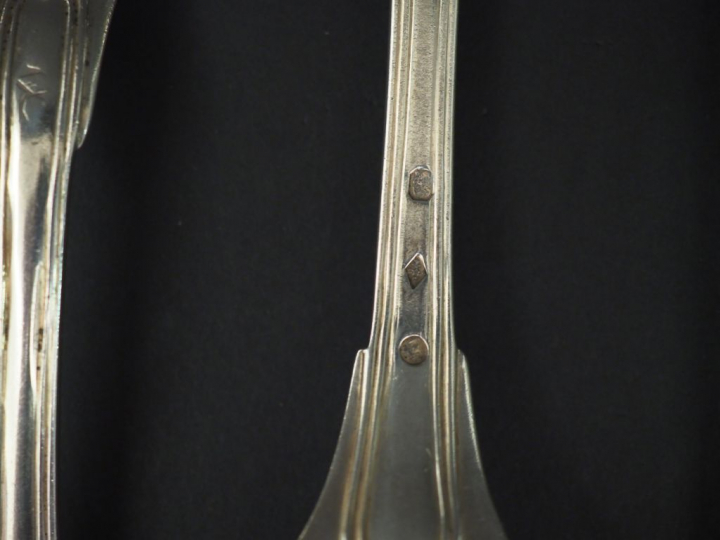 Ensemble comprenant :  - deux grands couverts Restauration en argent, 